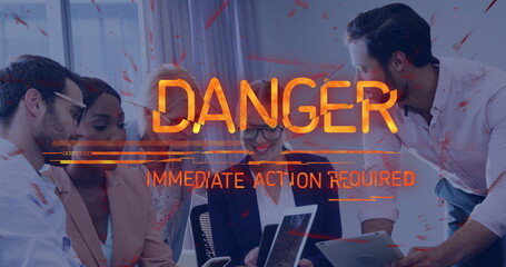 Danger warning text image over business meeting with diverse professionals