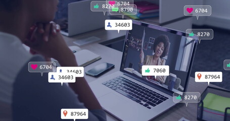 Watching image on laptop, person in school receiving social media notifications