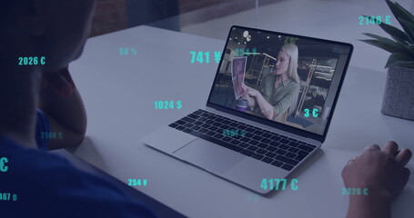Watching image of floating currency symbols, person on image call with laptop