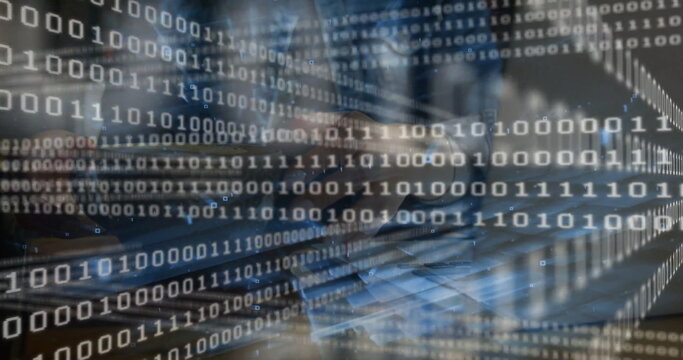 Woman's hands typing code on laptop keyboard at desk, with long sleeve shirt and binary overlay