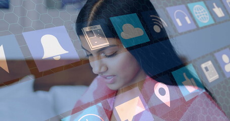 Using image, woman interacting with digital interface and app icons floating