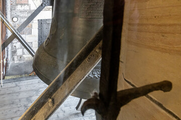 Decoratively decorated body of large bell on the bell tower of St Vitus Cathedral in Prague in Czech Republic