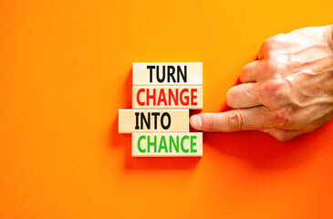 Turn change into chance symbol. Concept words phrase Turn change into chance on beautiful wooden...