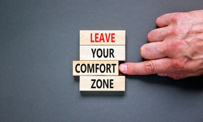 Leave your comfort zone symbol. Concept words Leave your comfort zone on beautiful wooden blocks....