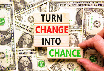 Turn change into chance symbol. Concept words phrase Turn change into chance on beautiful blocks....
