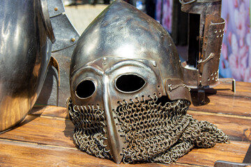 Knight's helmets made of iron on a wooden surface