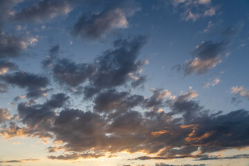 Fototapeta premium Beautiful orange sunset sky, with clouds,. Evening sky background.