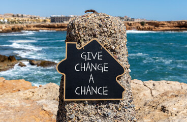 Give change a chance symbol. Concept words phrase Give change a chance on beautiful black...