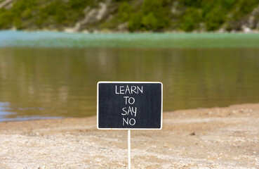 Learn to say no symbol. Concept words phrase Learn to say no on beautiful black blackboard....