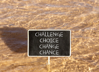 Naklejka premium Challenge choice change chance symbol. Concept words Challenge choice change chance on beautiful blackboard. Beautiful sea water background. Business Challenge choice change chance concept. Copy space