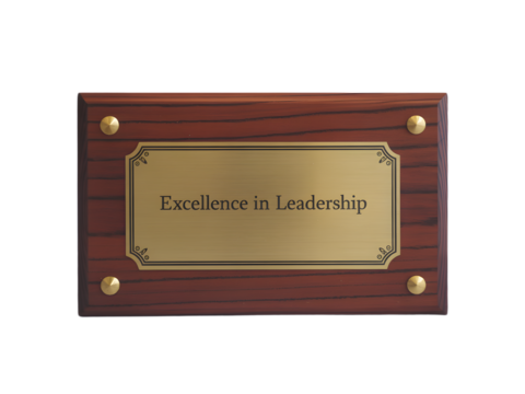Excellence in Leadership is engraved on a distinguished award plaque with a refined wooden base and elegant gold accents, transparent background