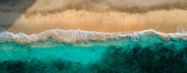 Top view of tropical blue sea and beach shoreline, clear turquoise water, peaceful summer coastal scene with waves and vibrant natural colors, relaxing atmosphere.