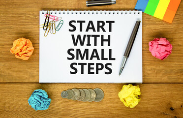 Start with small steps symbol. Concept words phrase Start with small steps on beautiful white note....