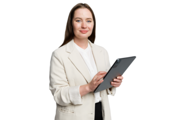 Confident professional woman engaged with a digital tablet while standing against a clean background