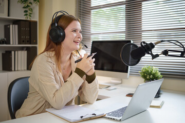 Confident host discussing topics for her podcast while streaming in a stylish office.