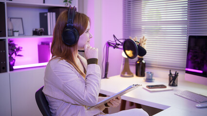 Podcaster engaged in conversation, speaking into a microphone in a vibrant recording space.
