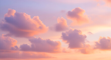 Obraz premium Dreamy Pastel Skies Billowing Clouds at Sunset with a Soft Pink and Purple Hues