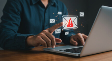 Cyber Threat Alert: A person, engrossed in safeguarding data on their laptop, is shown with a digital visual, indicating a cyber threat, representing online security risks.