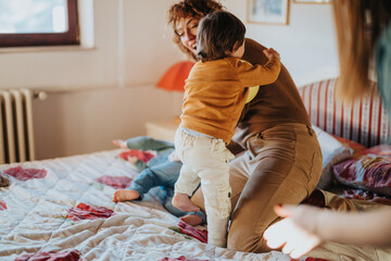 A joyful moment as a family enjoys time together at home, featuring a playful scene with a toddler...