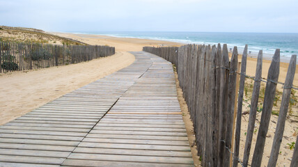 wooden floor pathway access in lacanau ocean beach in west coast in southwest sea coast in France