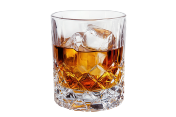 Cut crystal glass filled with whiskey showcases elegance and sophistication while reflecting light in an inviting setting