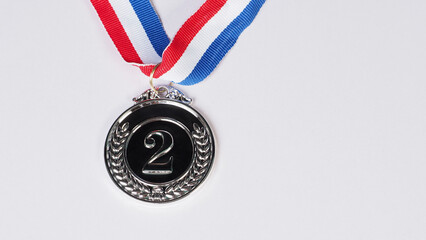 Silver medal award on white background.