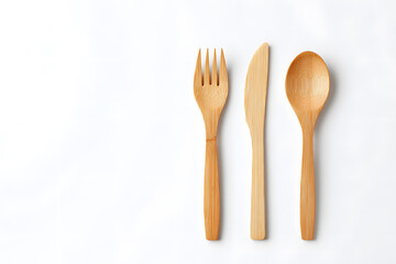 Bamboo cutlery set on white background. Eco-friendly bamboo cutlery set including fork, spoon, knife, and chopsticks, isolated on white. Ideal for sustainability, zero waste, and eco-lifestyle