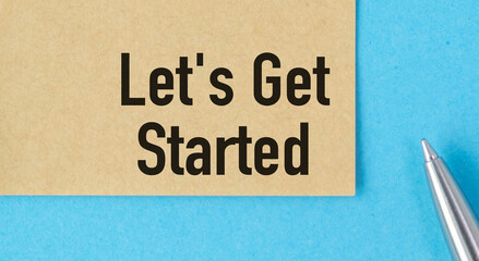 A pen is on top of a piece of paper that says Let's get started