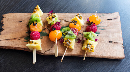 Fresh summer fruits on sticks. Studio shot