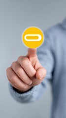Close Up of a Hand Interacting with a Yellow Circular Interface Icon