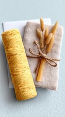 Yellow Twine Bundle with Beige Fabric and Dried Flowers