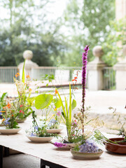 Ikebana flower arrangements displayed on table during workshop