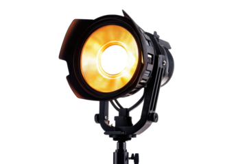 Studio spotlight emits a warm glow, creating an inviting atmosphere perfect for photography or theatrical performances in an indoor setting