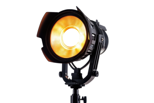 Studio spotlight emits a warm glow, creating an inviting atmosphere perfect for photography or theatrical performances in an indoor setting