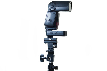 A powerful external speedlight flash unit, wirelessly connected via a mounted transmitter, shown on a versatile light stand adapter, perfect for photographers needing portable illumination.