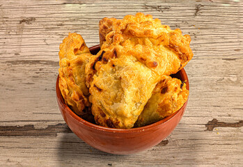 Homemade Empanadas in Rustic Clay Bowl