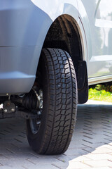 This is a detailed close up view of a tire mounted on a car