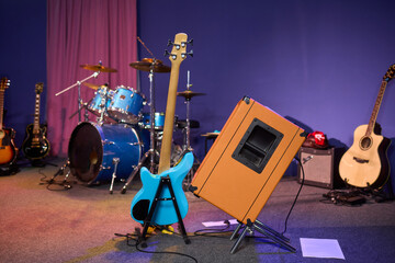 A musician is adjusting the amplifier on stage during a live performance for dynamic sound