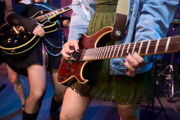 An Energetic and Enthralling Guitar Performance by Trendy Musicians on a Vibrant Stage