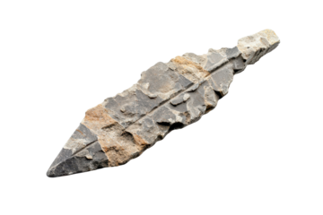 Primitive stone arrowhead features intricate details and a unique shape, showcasing ancient craftsmanship and tool-making skills from prehistoric cultures