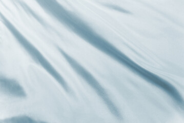 Soft white silk waving in natural light, ideal for elegant textures, minimalist backgrounds, or product mockups in high-end design