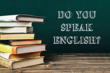 Stack of books with the words Do you speak English written on top