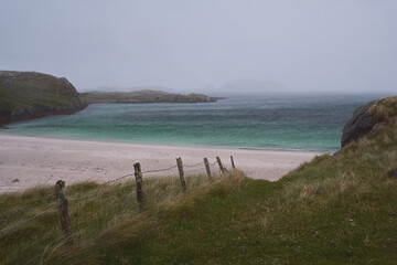 A sand beach and the turquoise sea in the north of Scotland. Isle of Lewis, Scotland. Vacation holiday banner