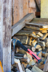 Axe in Front of a Stack of Firewood. Vertical
