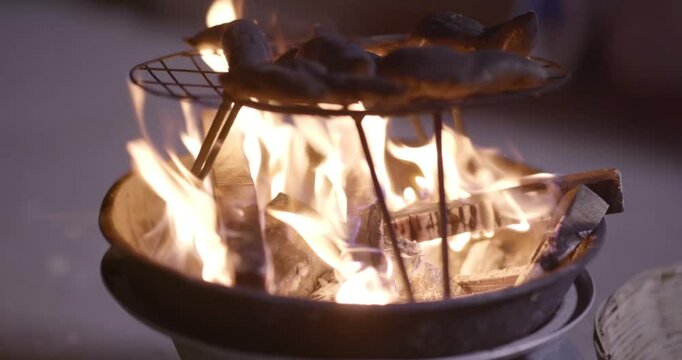 Traditional Fire-Roasted Sweet Potatoes on Open Flame