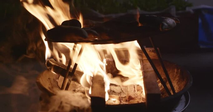 Traditional Fire-Roasted Sweet Potatoes on Open Flame