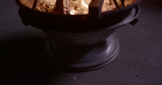Traditional Fire-Roasted Sweet Potatoes on Open Flame