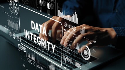 Person Typing on Laptop with Data Integrity Graphics and Digital Analysis Interface in Modern...
