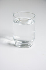 A glass of water isolated on a white background. Close-up.
