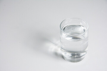 A glass of water isolated on a white background. Close-up.
